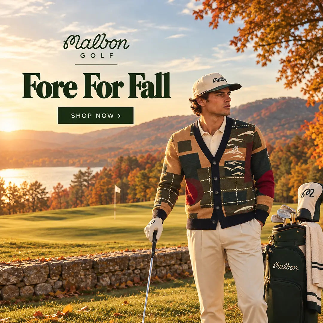 Golfer wearing Malbon golf branded Apparel and hat standing in front of golf course with scenic lake in the background